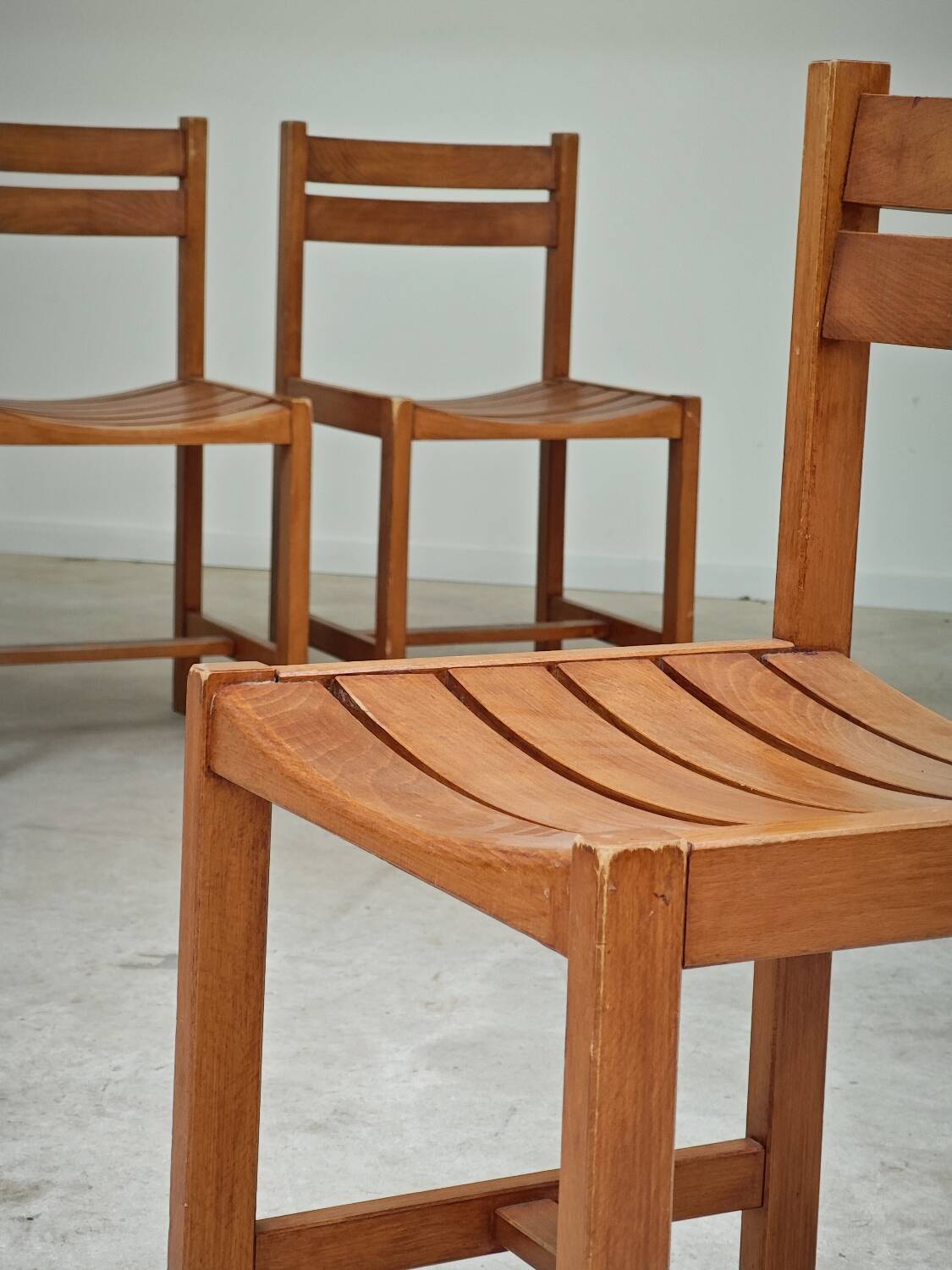 Set of 4 wooden chairs by André Sornay