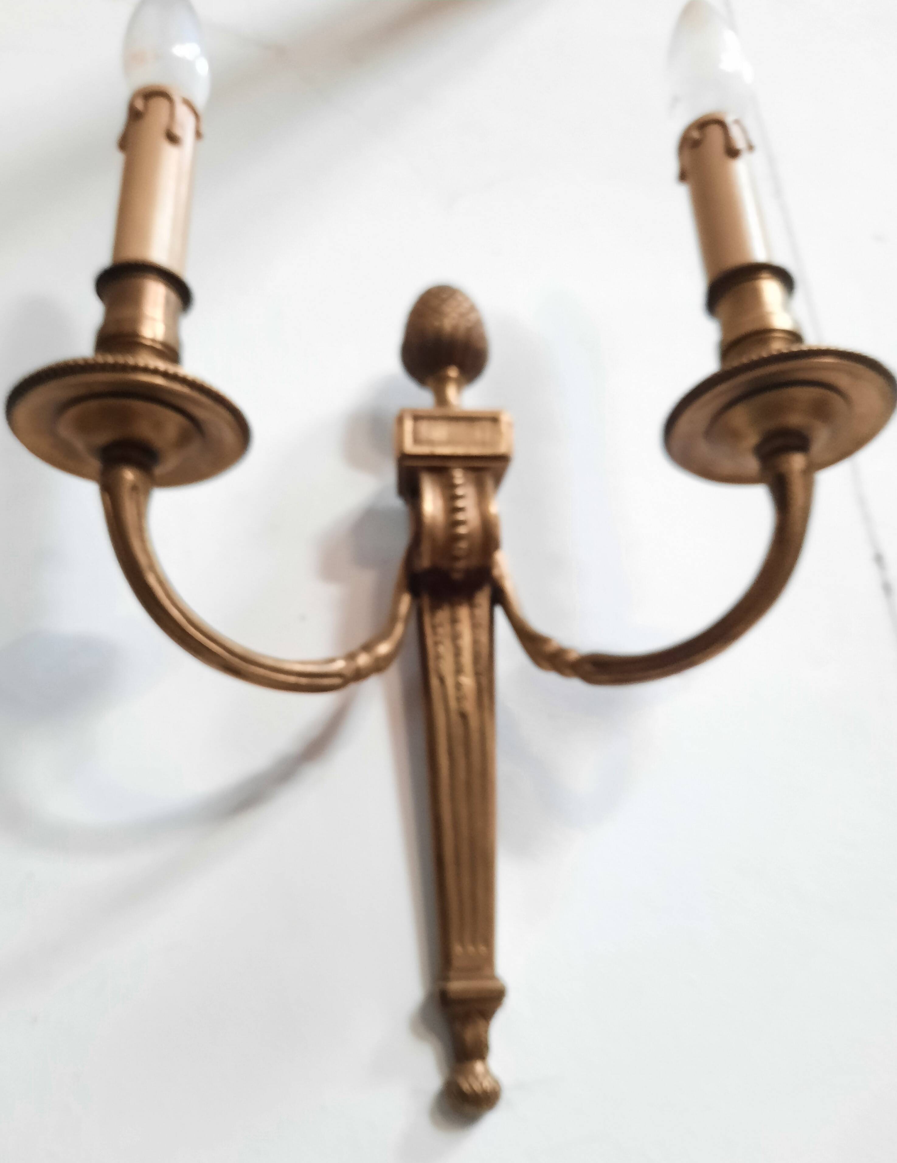 Pair of Louis XVI style bronze wall lights