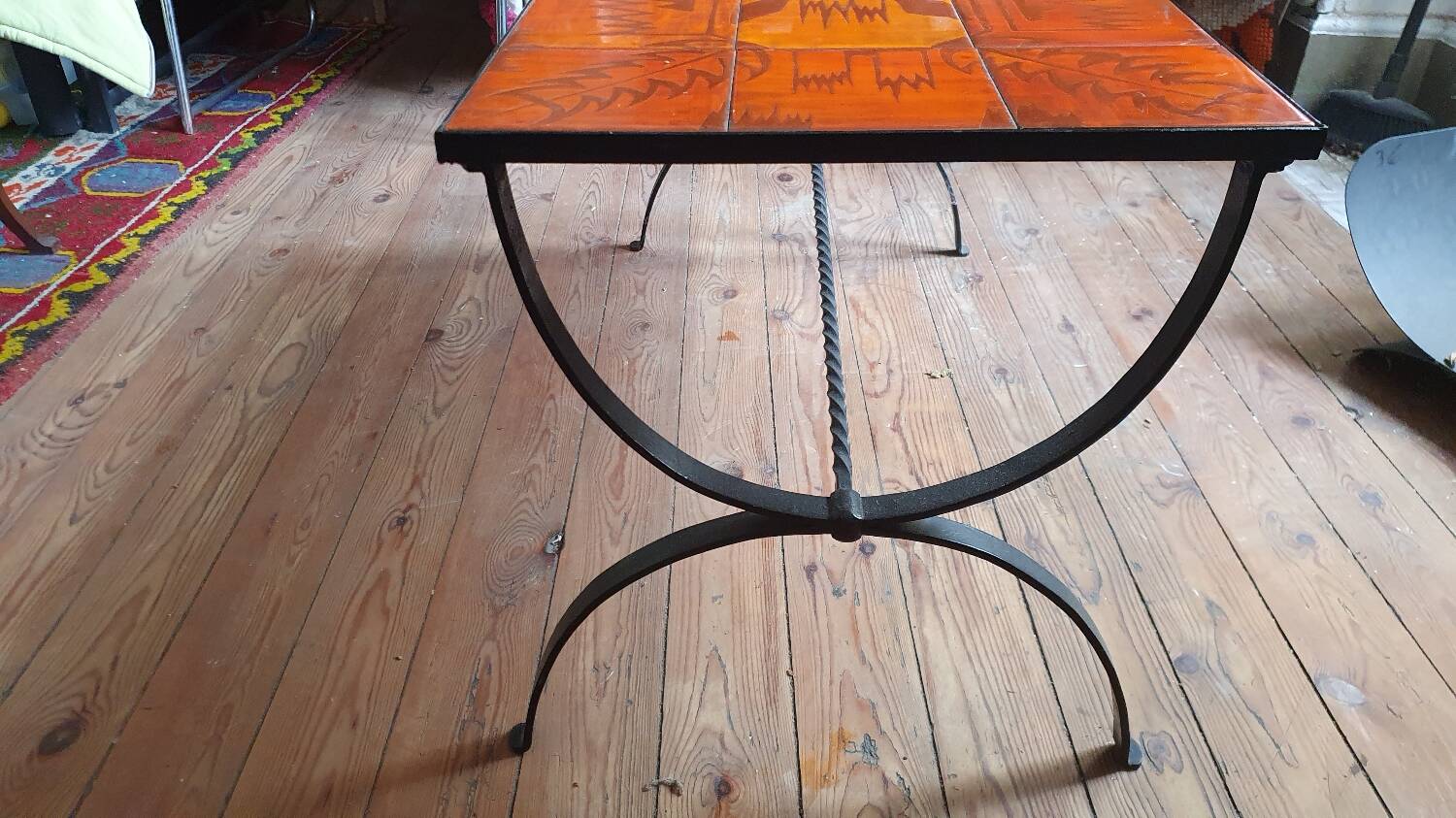 Wrought iron and orange ceramic coffee table