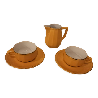 Set of two yellow Apilco coffee cups and saucers and a matching water or milk jar.
