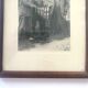 Fishing trophy with radiant faces, c. 1950. Black and white photograph.