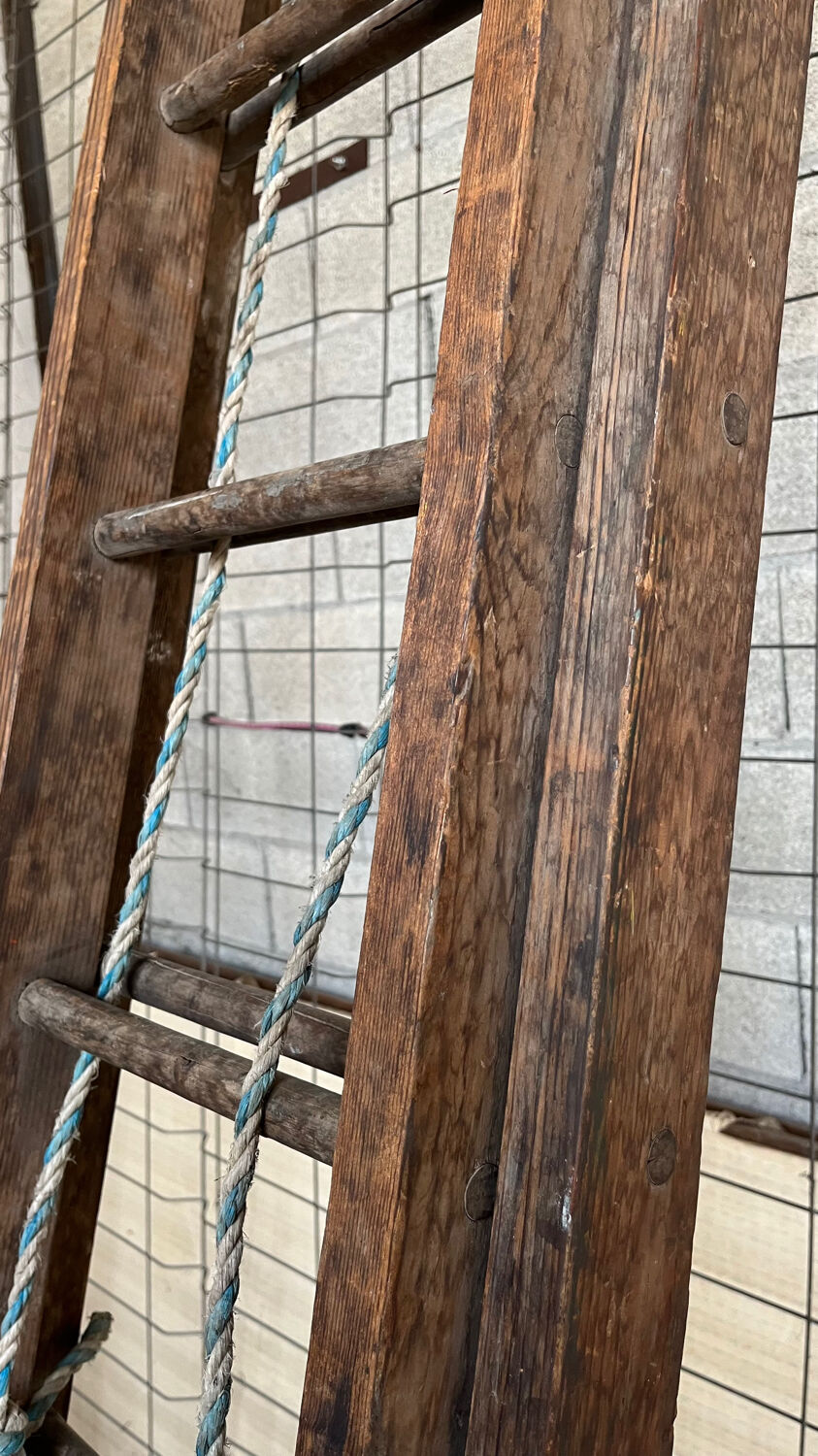 Very large vintage sliding wooden ladder