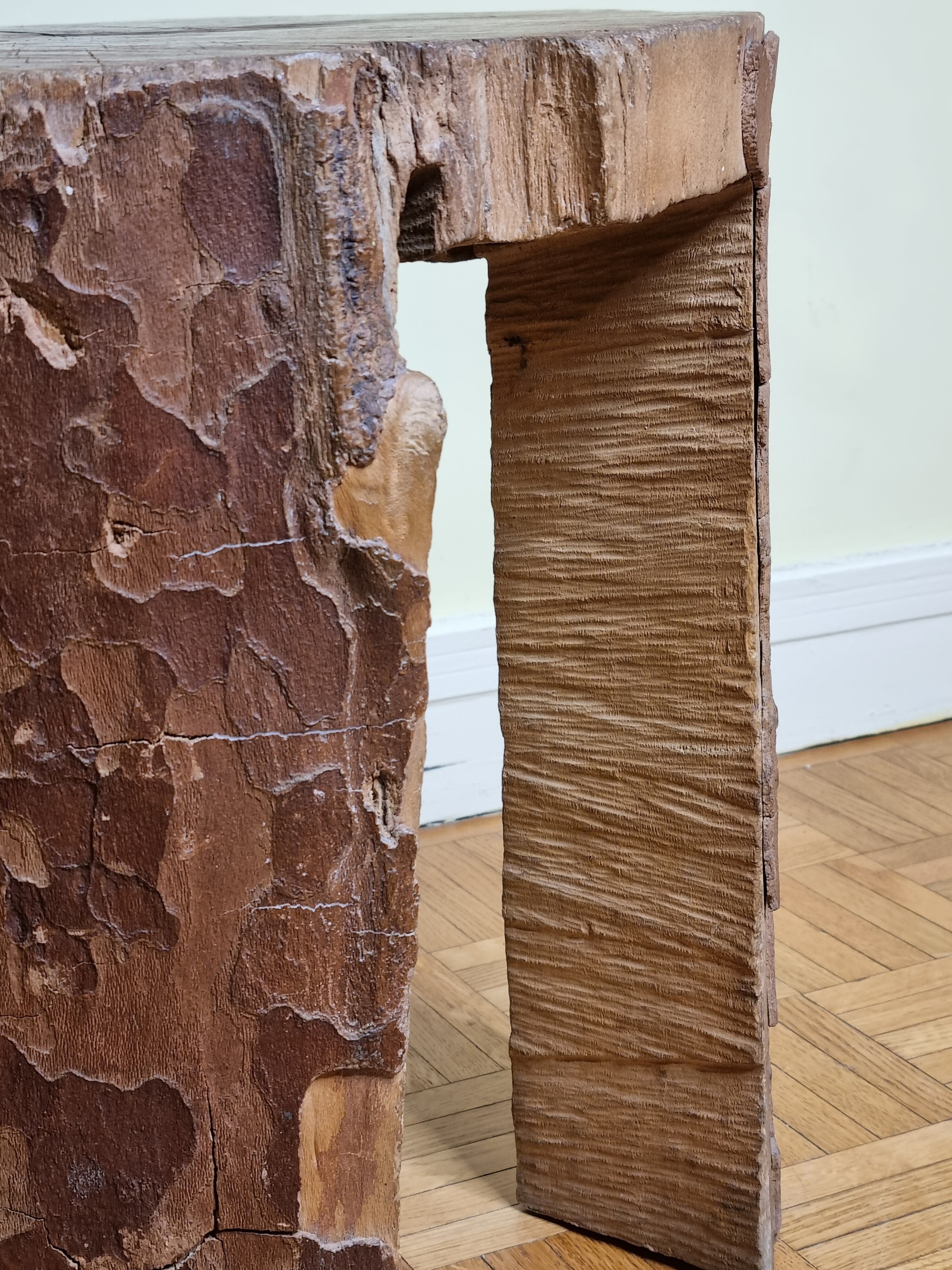 Brutalist solid wood coffee table carved from a room in a plane tree trunk