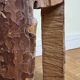 Brutalist solid wood coffee table carved from a room in a plane tree trunk