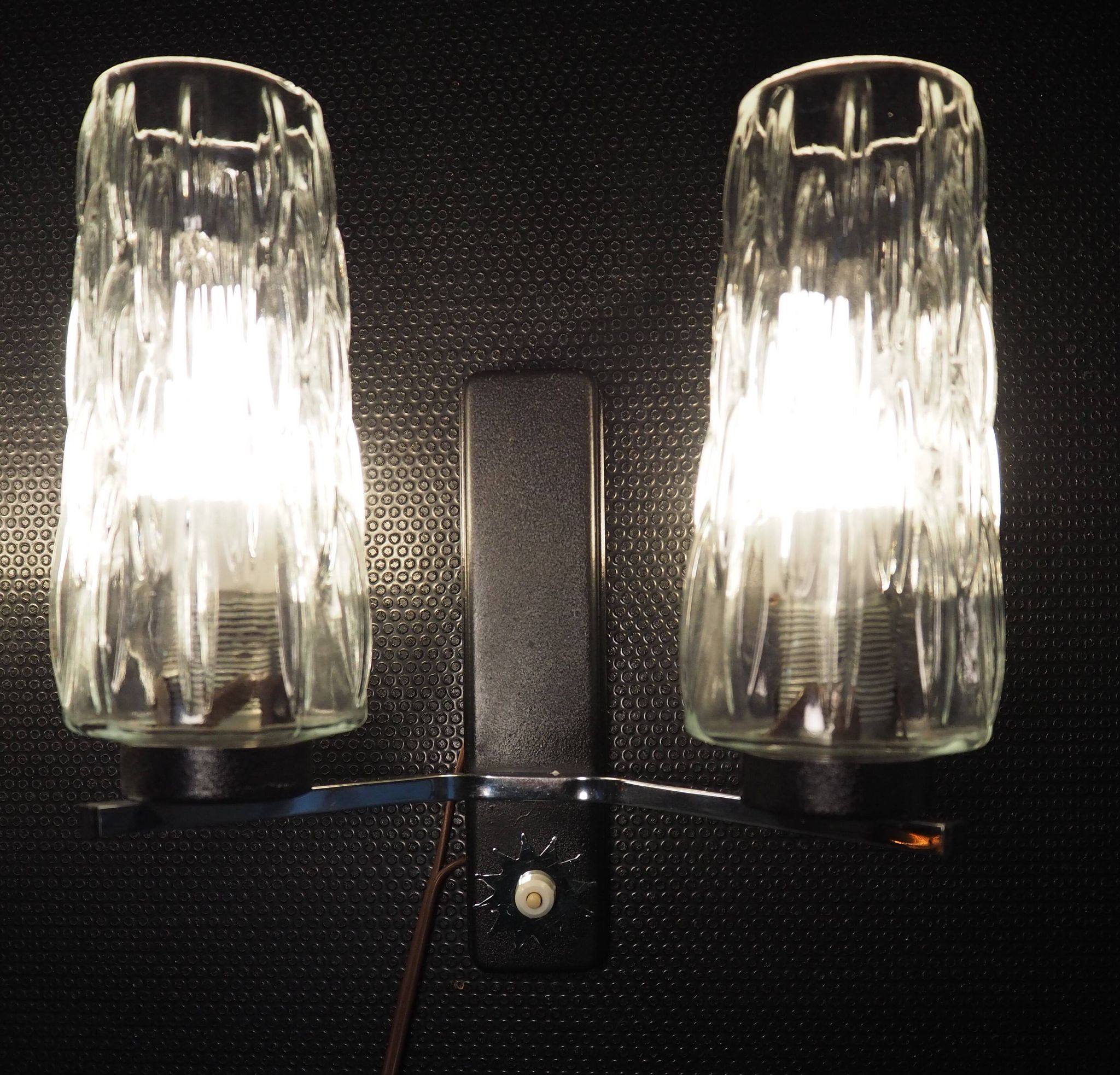 Pair of wall lights from the 1950s-1960s with a push button switch.