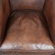 Great luxurious brown cowhide club armchair with matching piping
