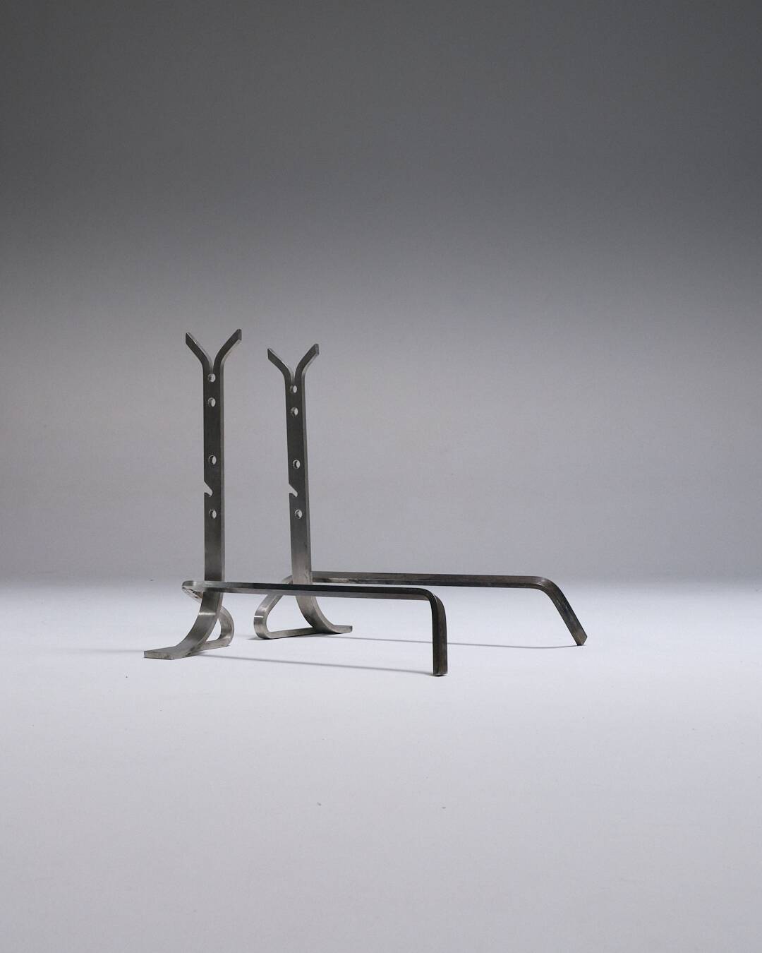 Pair of modernist brushed steel andirons, 1970s