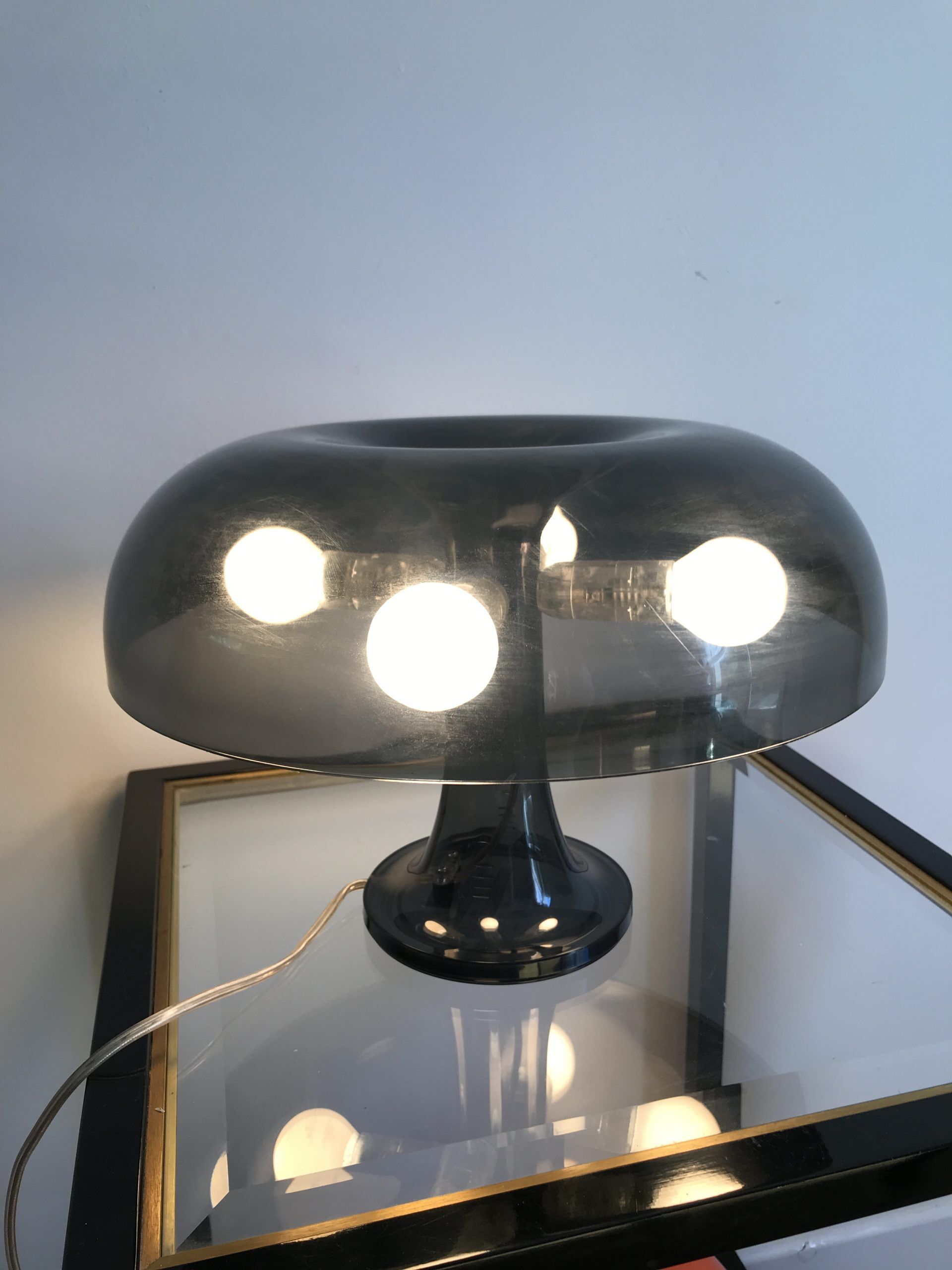 Nessino black pose lamp for artemide by giancarlo mattioli
