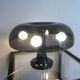 Nessino black pose lamp for artemide by giancarlo mattioli