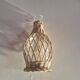 vintage glass vase surrounded by woven rattan