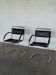 Vintage cantilever chairs in black saddle leather and chrome.