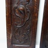 Pair of decorative wall panels in carved wood from the 19th century.