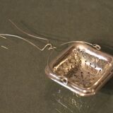 Silver metal tea grommet of square section