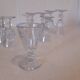 Set of 9 small cut glass stemmed glasses from the 1930s, in various sizes.