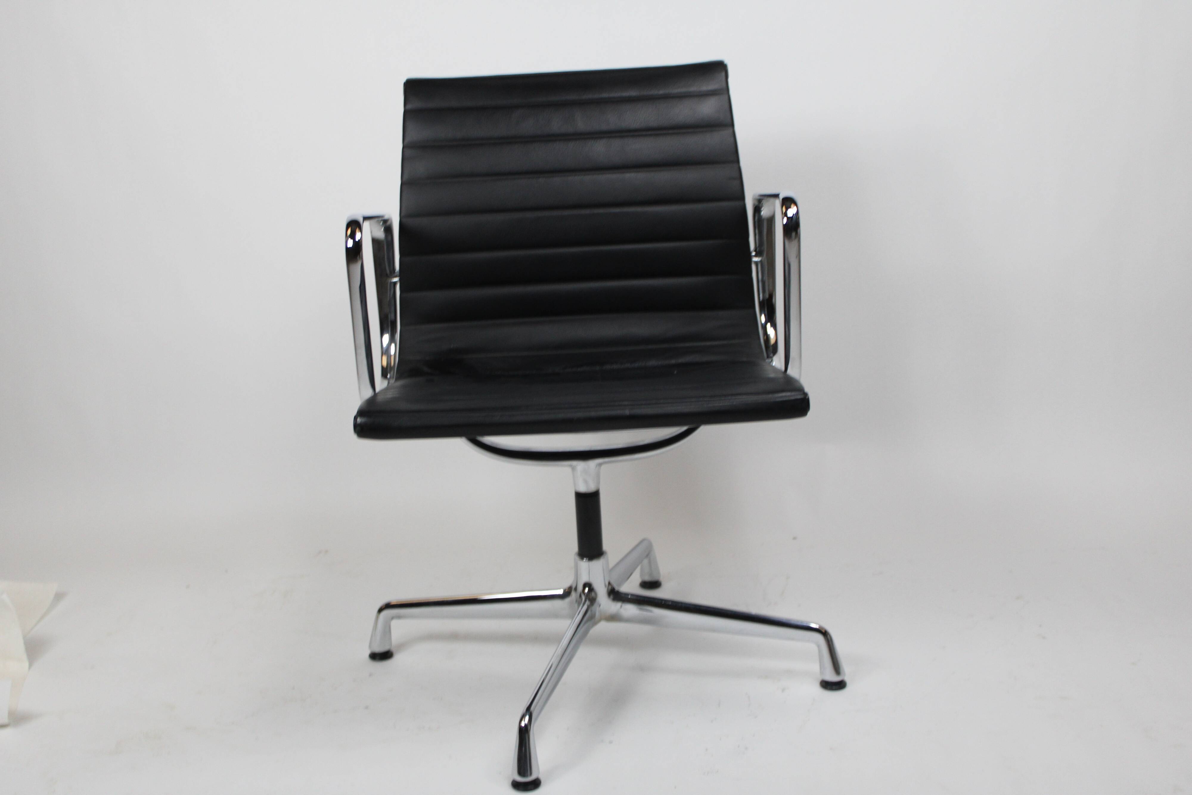 Vintage chair by charles eames ea 108 black leather edition vitra denmark