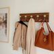Wall-mounted coat rack with 5 hooks in sage green, stained wood and patinated metal – 50cm