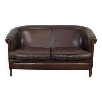 Sheepskin leather 2-seater club sofa in a beautiful dark color with black piping