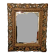 Miroir biseauté et bois sculpté