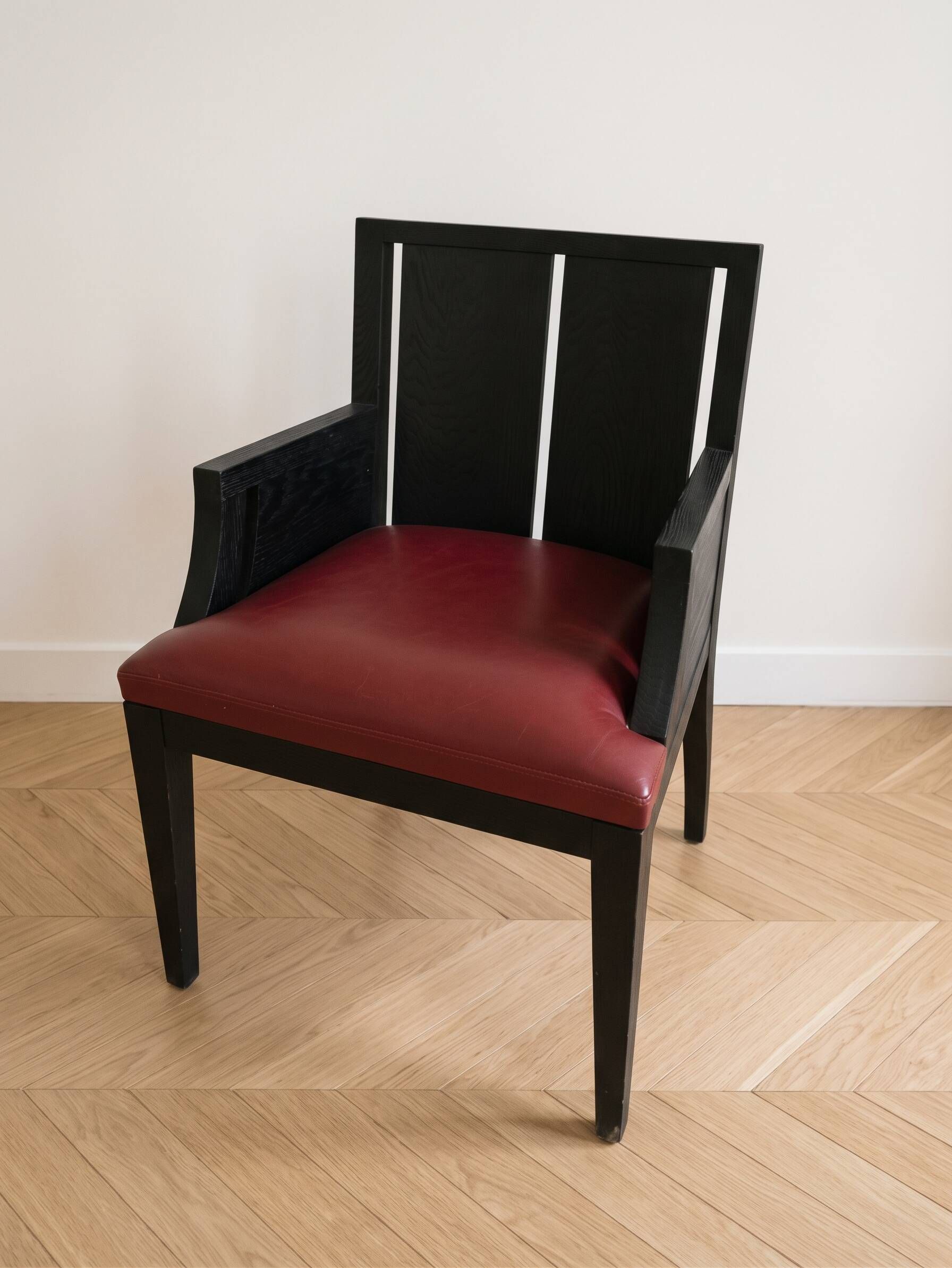 Designer armchair Philippe Hurel model Wallis in red leather and black beech.