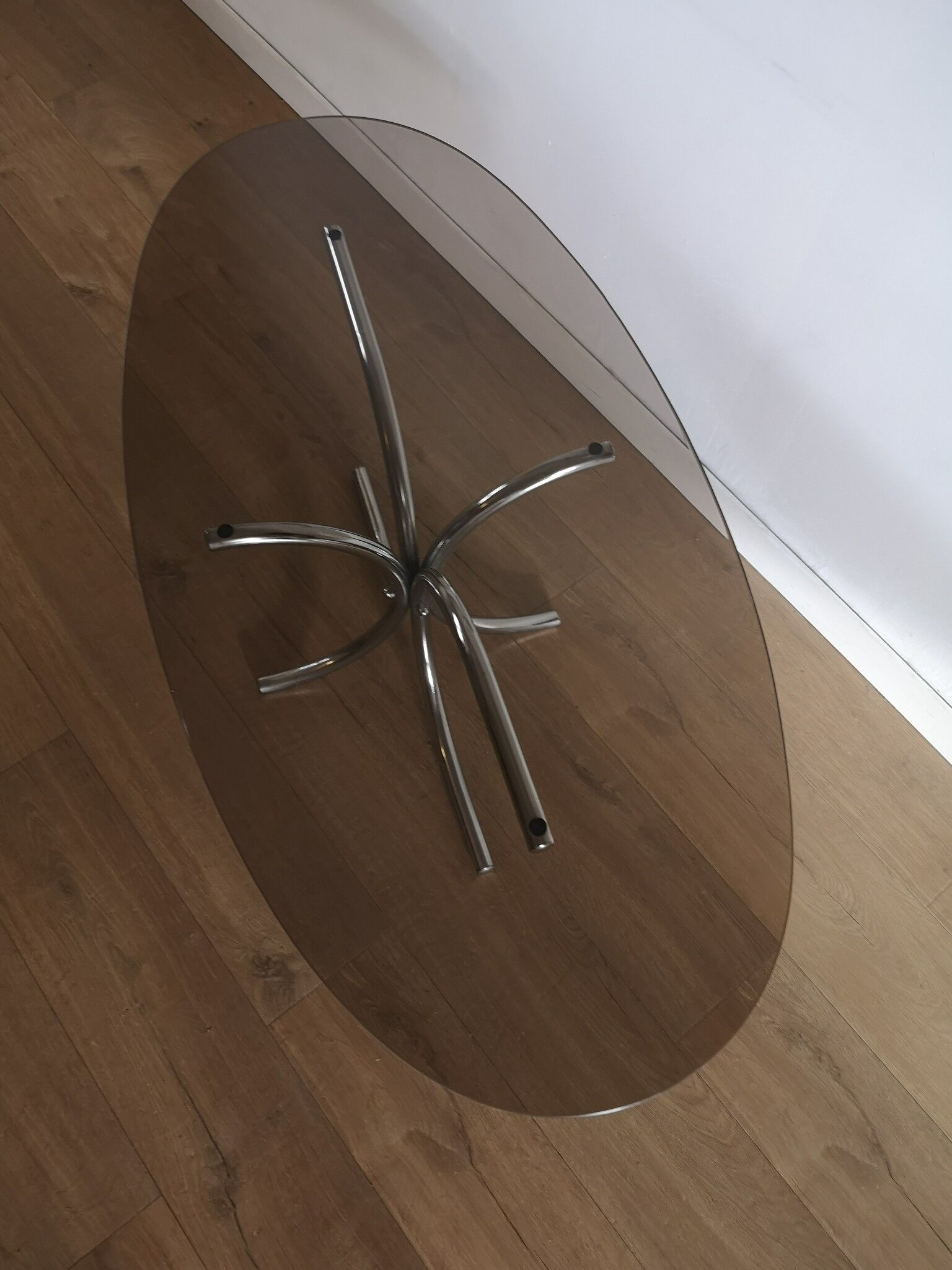 Oval smoked glass coffee table