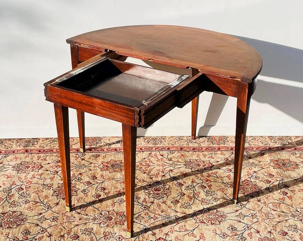 Empire-style demi-lune console from the 19th century.