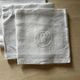 Set of six antique damask napkins with embroidered monogram.