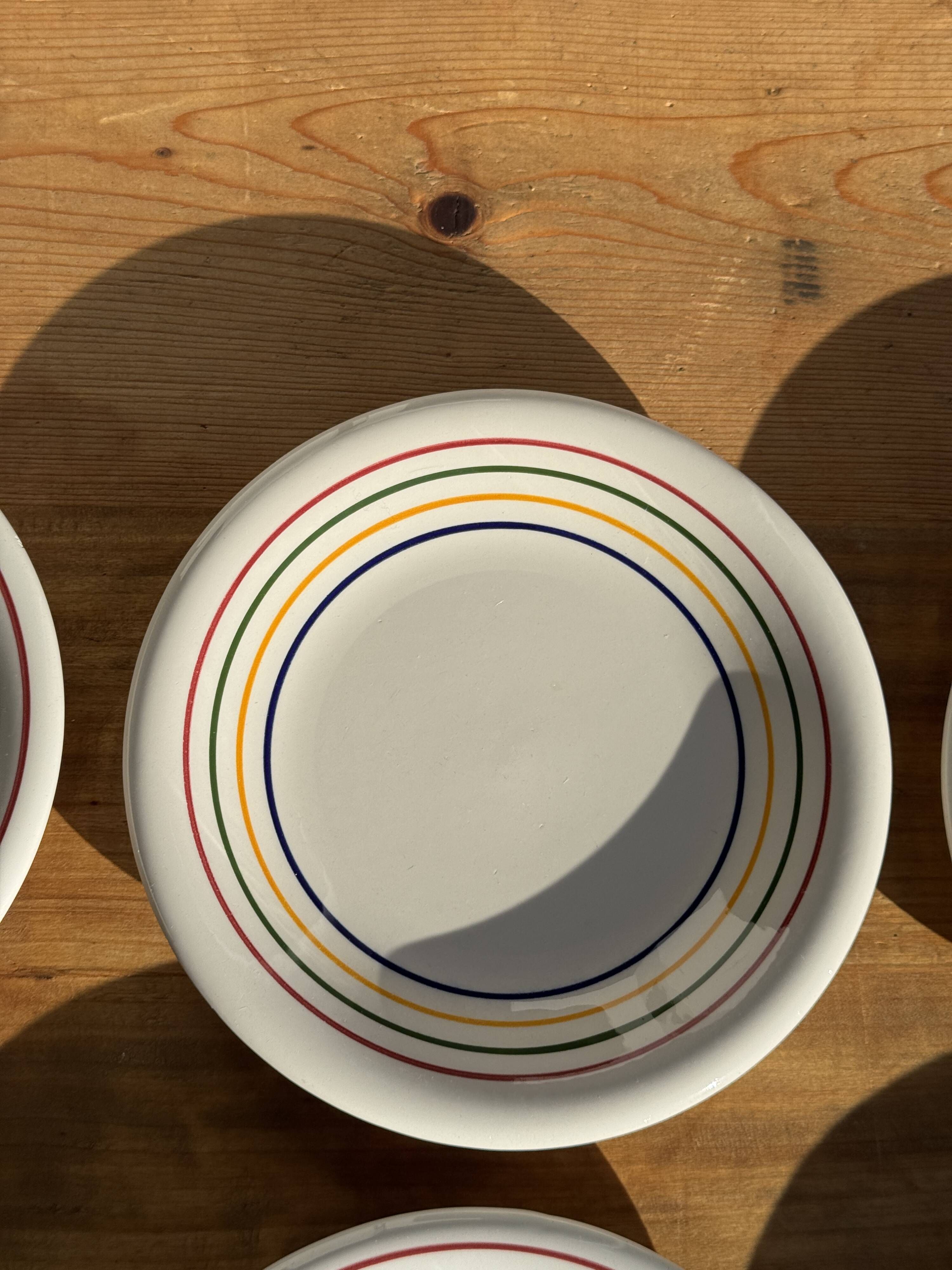 Set of 9 small Italian dessert plates Primula with red and green trim.
