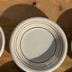 Set of 9 small Italian dessert plates Primula with red and green trim.