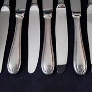 Set of 12 monobloc table knives in Comargent steel.