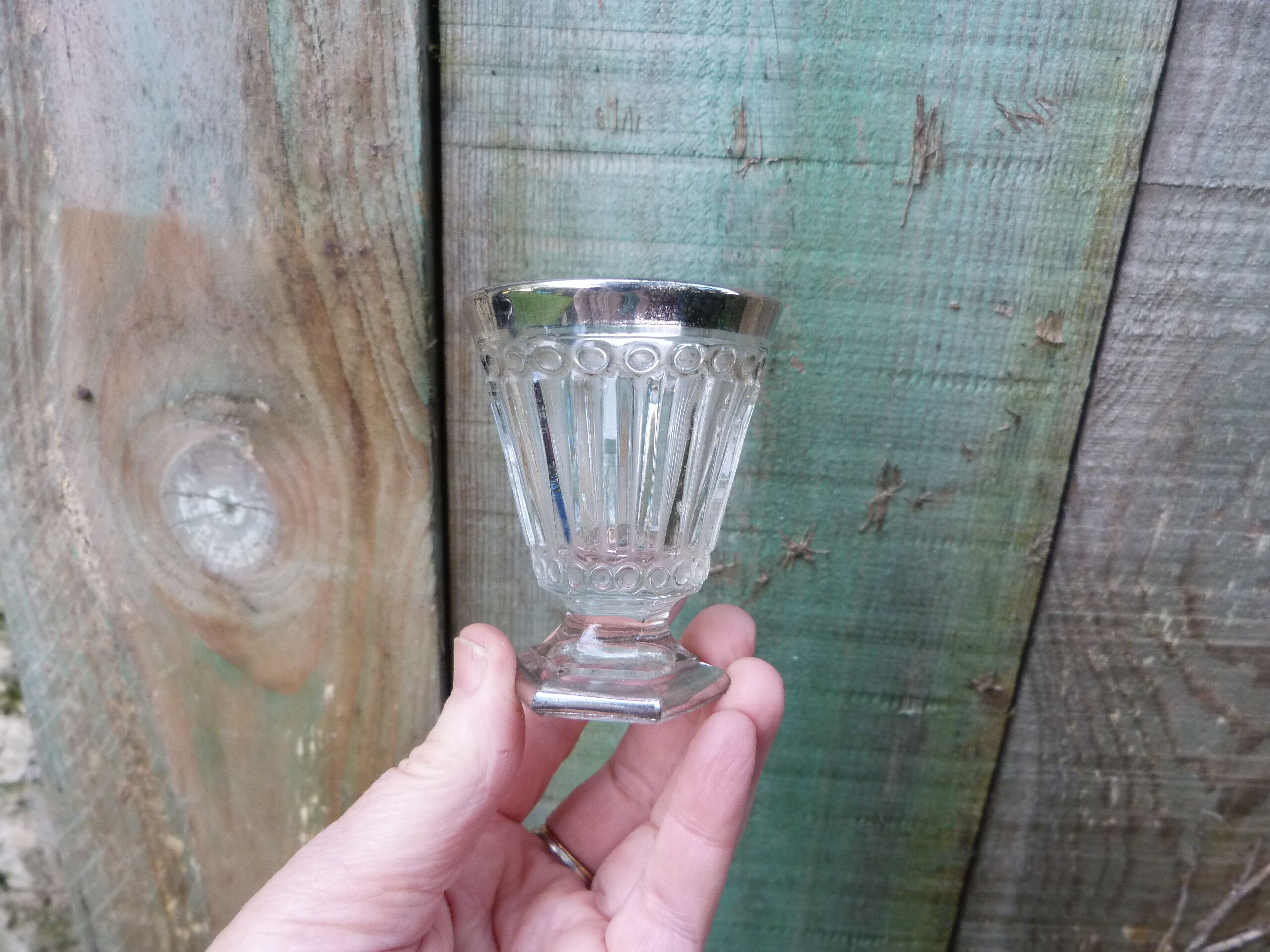 Stemmed glass for antique glass liquor with silver sides and patterns