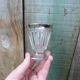 Stemmed glass for antique glass liquor with silver sides and patterns