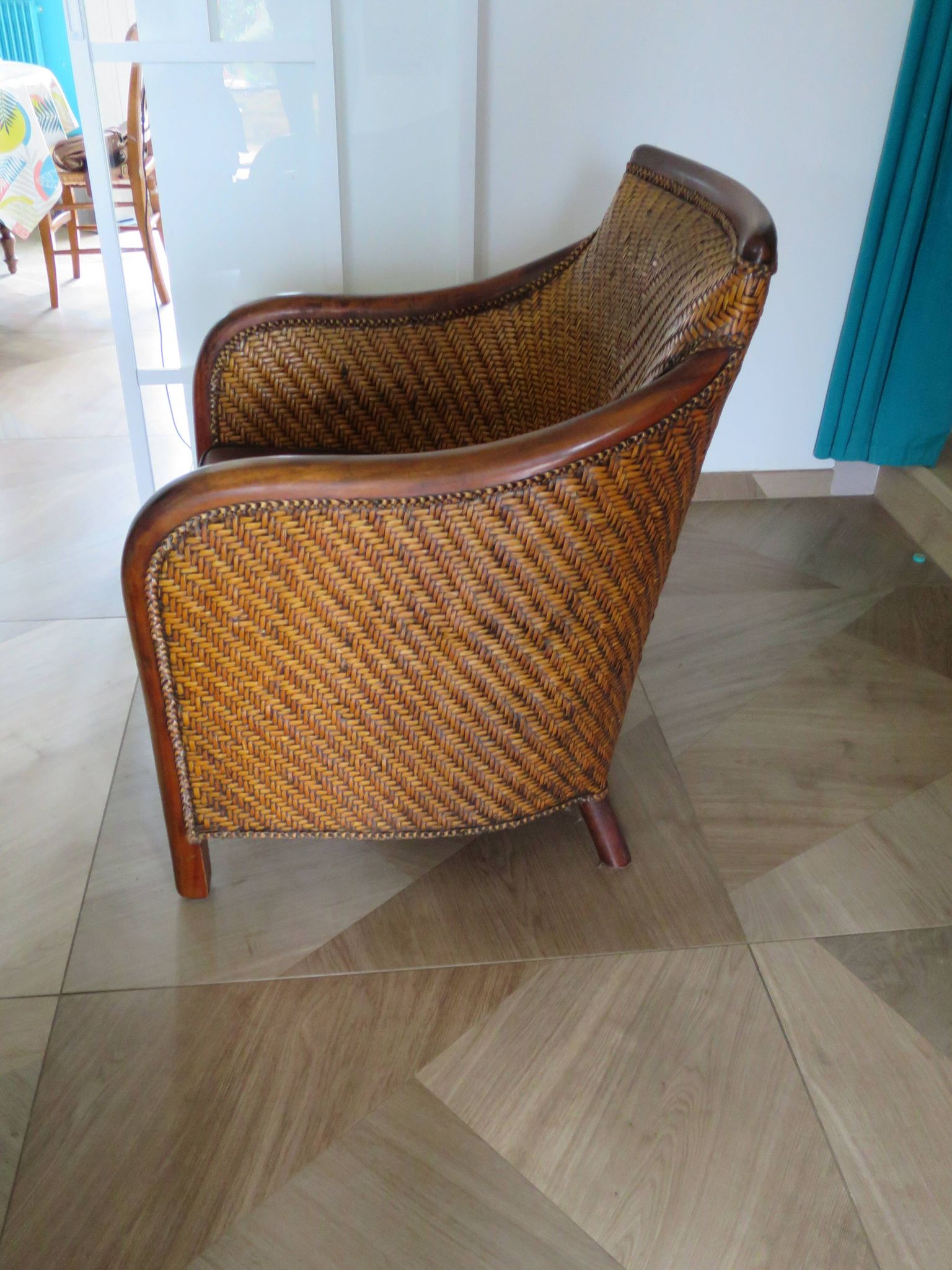 Woven rattan armchair and exotic wood in colonial style, 1980s.