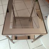 Smoked glass coffee table. 2 shelves. Metal frame. 1960s.