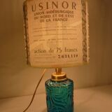 Table lamp with king blue and gold glass foot and machineinor action lampshade