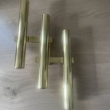 Tubular wall sconces in brass, Italian design from the 1970s, attributed.