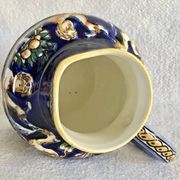 Old cream jug Gien Renaissance blue background 1938/1960