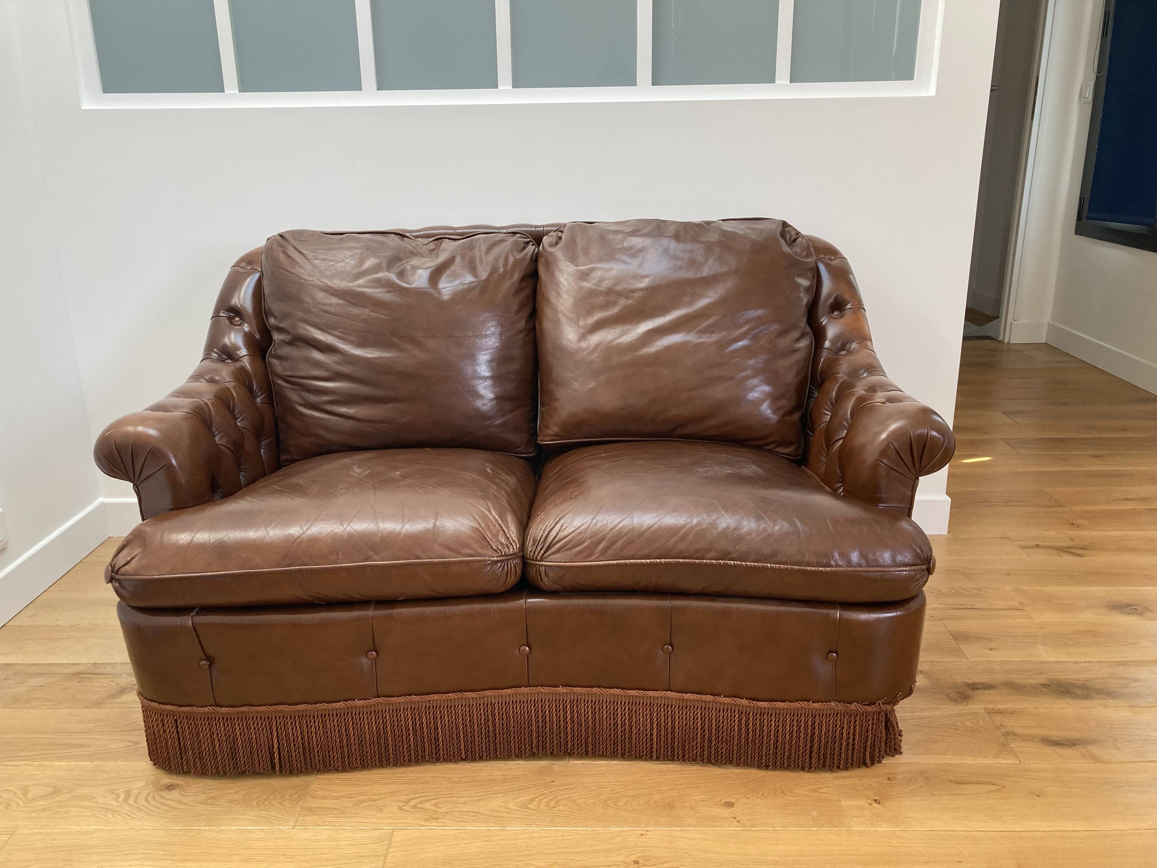 Chesterfield leather sofa with fringes