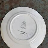 Collectible plate painted by Henry Simon, market gardening at the inn, in enameled ceramic,