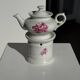 Complete porcelain teapot and warmer with pink floral decoration H18