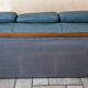 Three-seater sofa in green leather with a solid wood frame