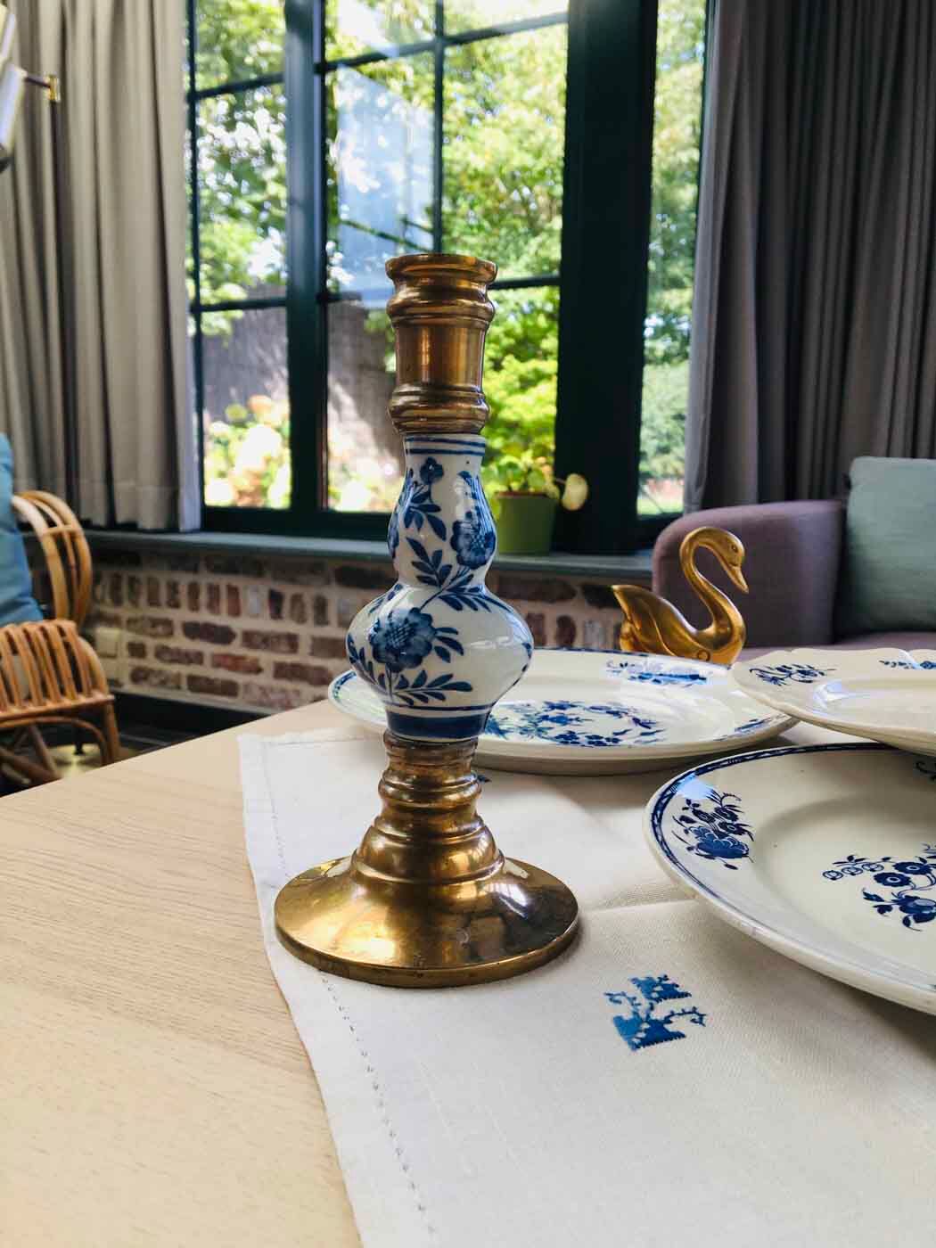 Delft brass and porcelain candlestick duo