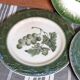 Antique earthenware plates with fruit decoration.
