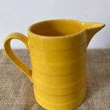 Old yellow porcelain pitcher stamped Saint Clément