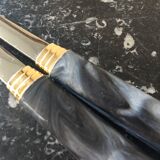Guy Degrenne salad cutlery in stainless steel and bakelite