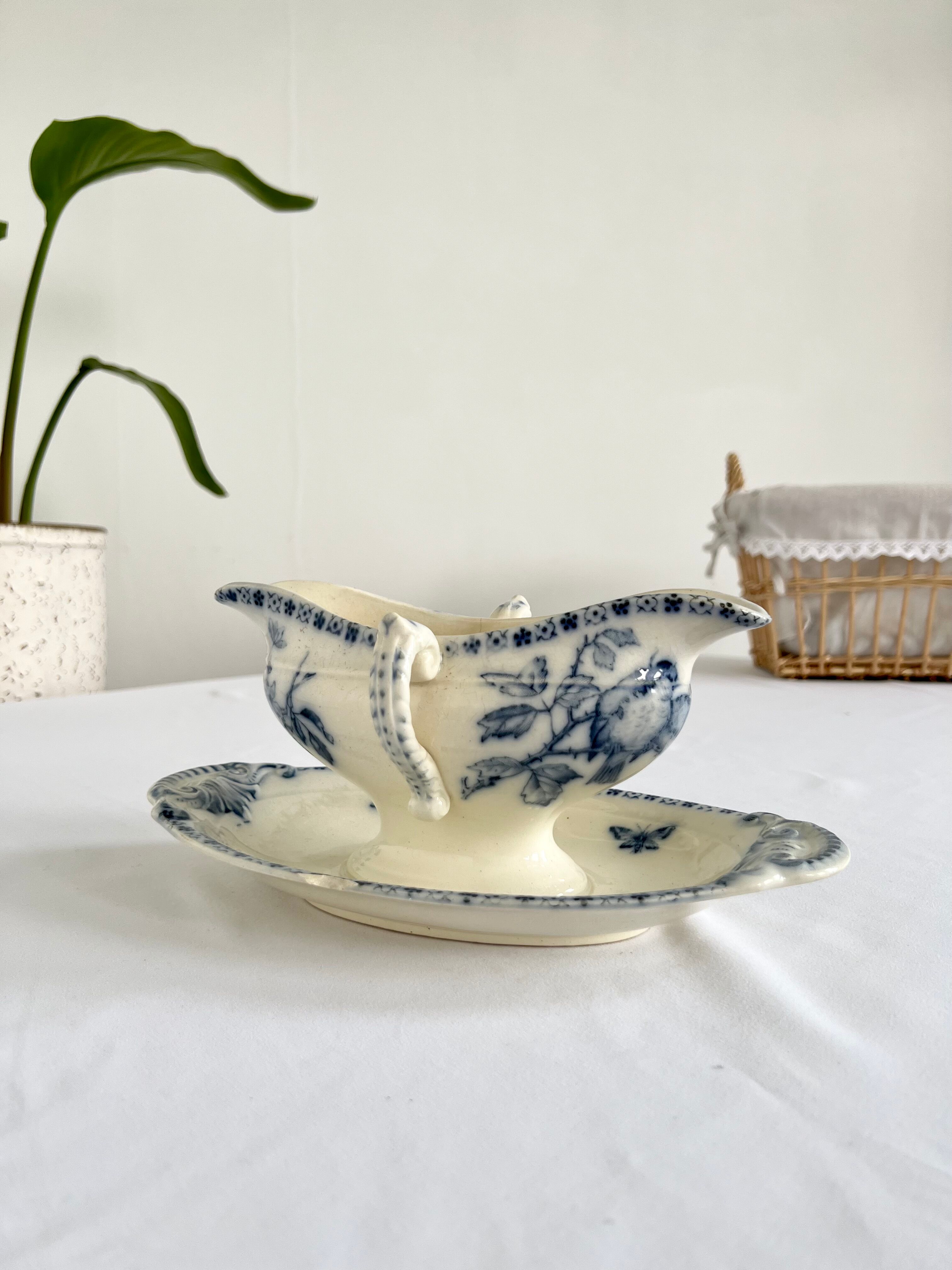 Saucière porcelain stamped Lunéville with double ivory and blue handles