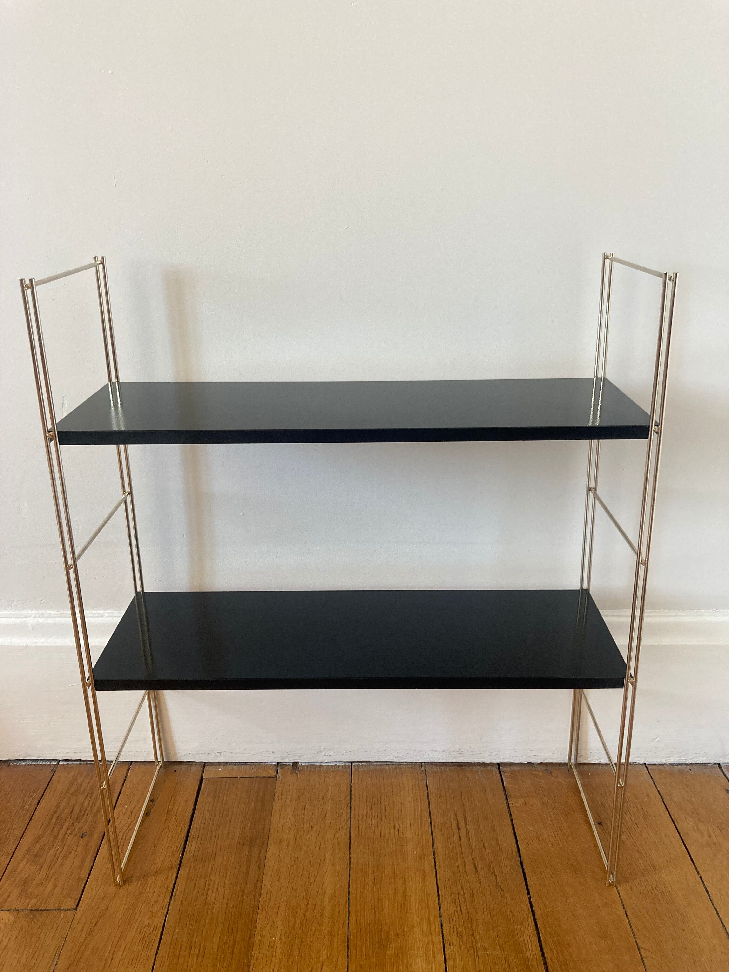 Black and gold string shelf