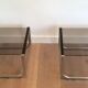Pair of side tables in chrome, blackened wood and glass.
