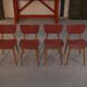 Ensemble de 4 chaises design chêne et skaï rouge 1960's