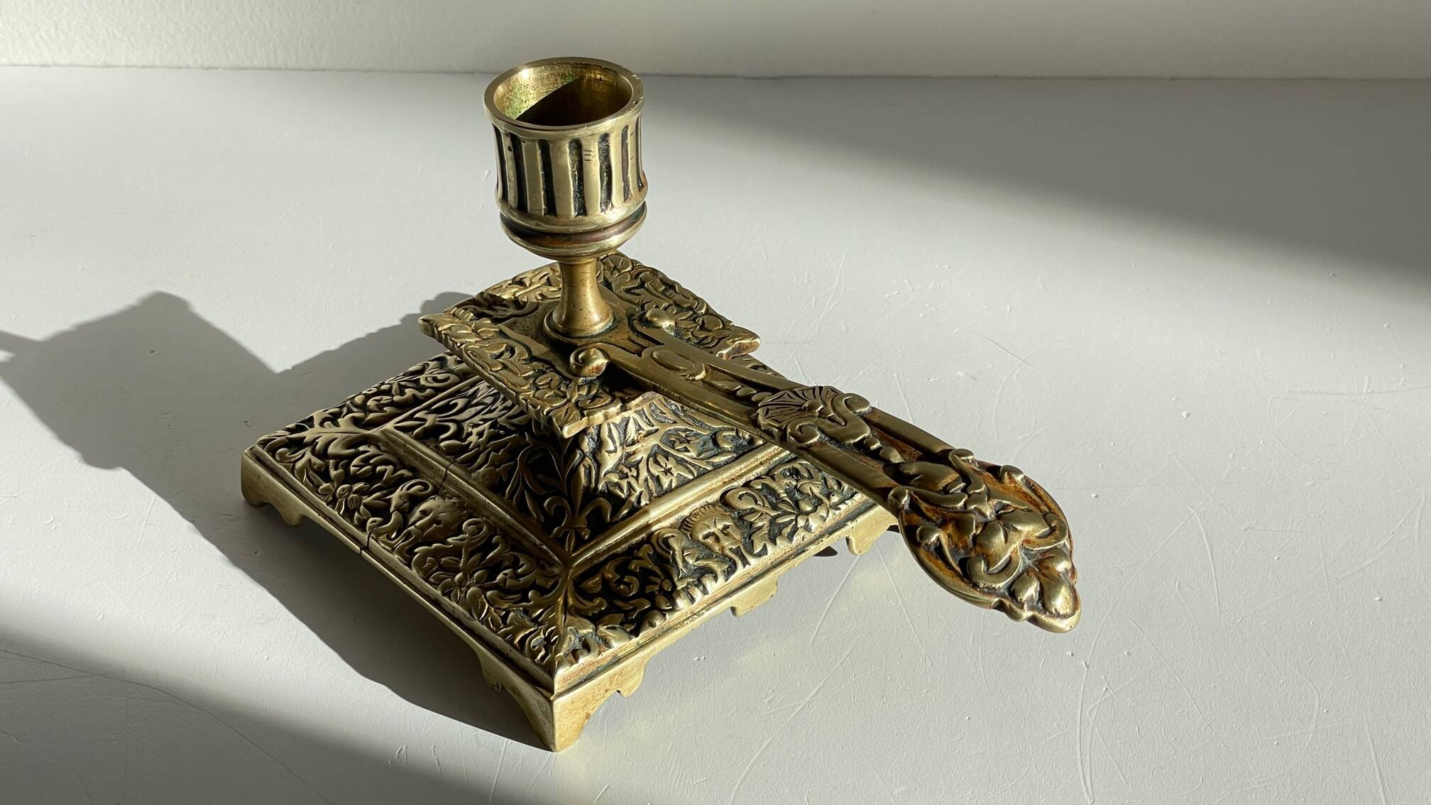 Patterned solid bronze hand candle holder