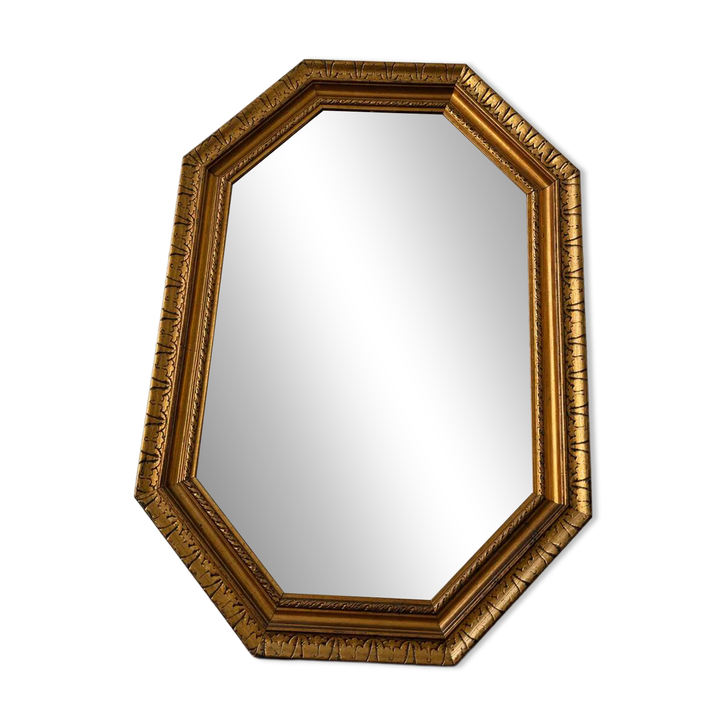 Octagonal gold mirror with copper reflections.